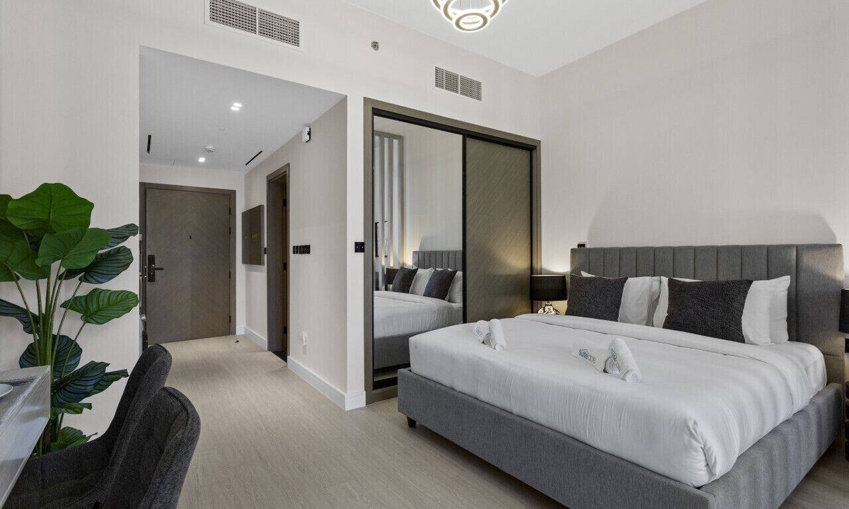 Business Bay Apartment | Studio Retreat with Canal and Burj Khalifa Views