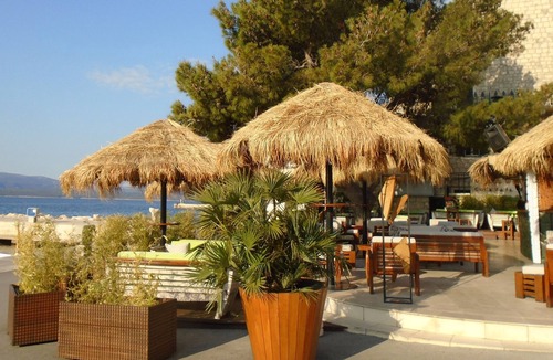 Cove Basina (Jelsa) House | Bol. Seafront house, near beach with private parking space.