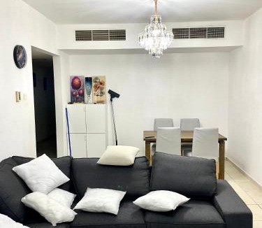 Al Nahda Apartment | Comfortable Apartment Bedroom And Spacious Living Room Family and Couple