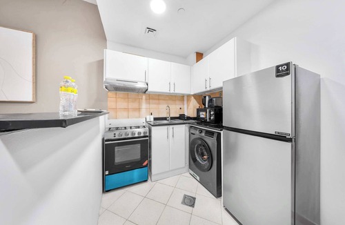 Dubai Production City Apartment | StayShort - Inviting Studio in Production City for 4