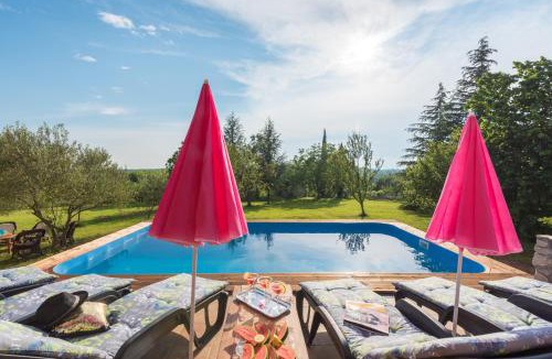 Topid House | Sunset holiday home with pool and large, mature garden