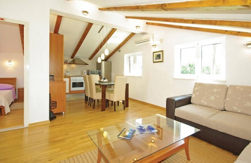 Slime House | This tastefully furnished cottage, surrounded by nature, consists of two living units connected by e