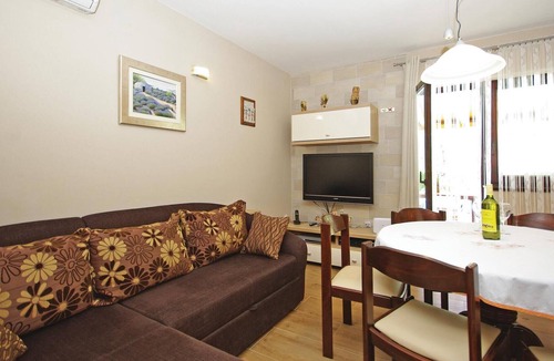 Slime House | This tastefully furnished cottage, surrounded by nature, consists of two living units connected by e