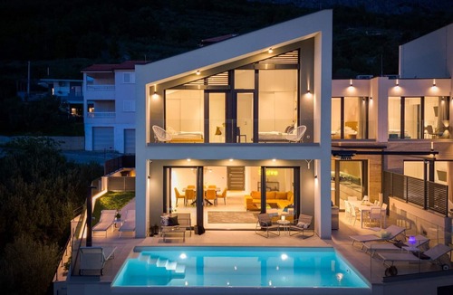 Jesenice Villa | Three-bedroom Villa Sunshine with a heated pool, media room, and views of the sea