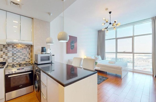 Jumeirah Village Triangle Apartment | Vacationer Holiday Homes l Bright and Spacious Studio in JVT l Free Pool,Gym