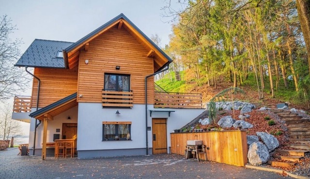 Double bedroom with balcony and idyllic view surrounded by nature in Celje