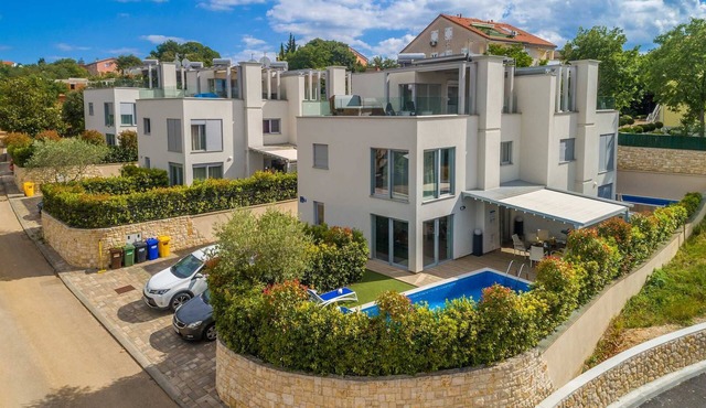 Modern villa MODERNA with heated pool, hot tub and sauna in Malinska