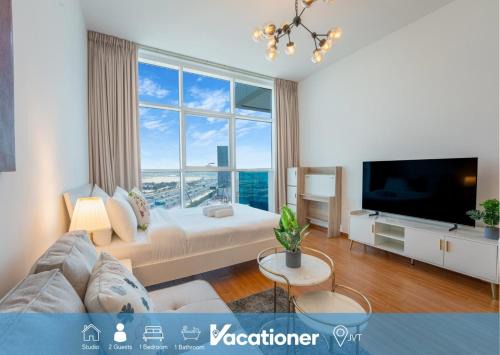 Vacationer Holiday Homes l Bright and Spacious Studio in JVT l Free Pool,Gym in Dubai