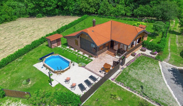 Wooden house with a sauna and an above-ground pool, surrounded by nature in a peaceful setting near Vrbovec.