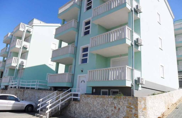 Holiday apartment with pool and sea view