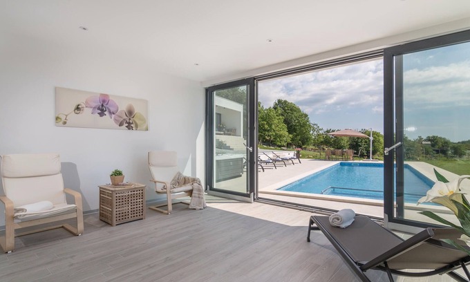 Jezenj House | This modern holiday home with pool is located near the village of Tinjan in inland Istria.