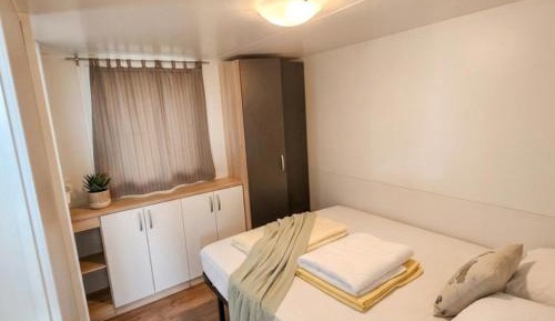 Comfort Two-Bedroom Mobile Home with Terrace and Pool View
