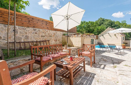 Drnis House | Welcome to this charming and traditional holiday home with pool in a delightful landscape.