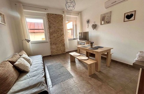 Gospic Apartment | Cosy 2-room apartment with a balcony just steps away from the beach, shops and restaurants