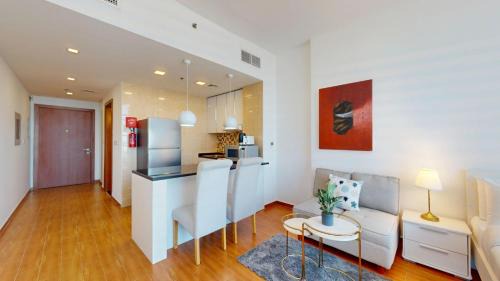 Jumeirah Village Triangle Apartment | Vacationer Holiday Homes l Bright and Spacious Studio in JVT l Free Pool,Gym