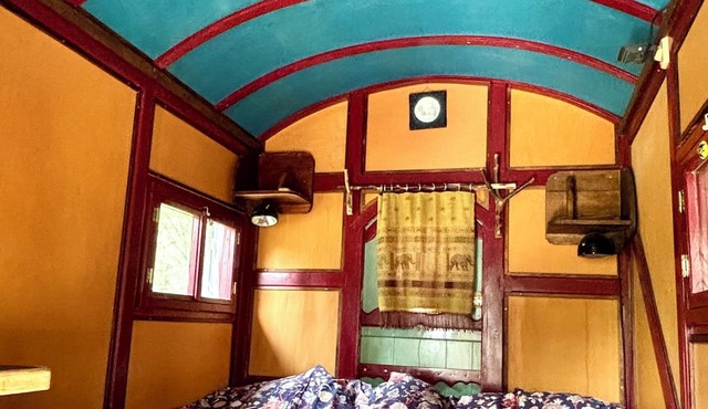 Cozy shepherd's hut in an edible landscape on a permaculture farm